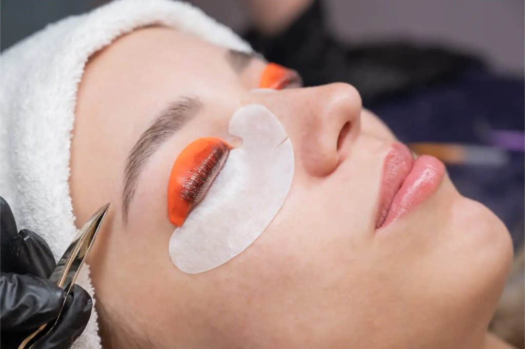 Close-up of eyelash extension application during a spa treatment.