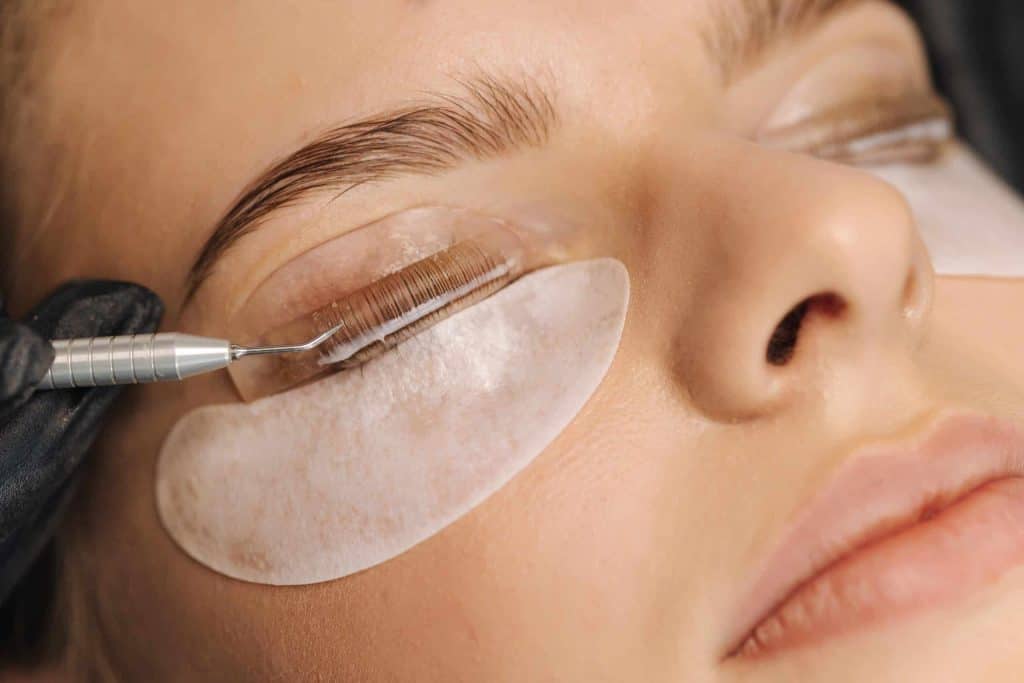 Close-up of eyelash extension procedure at Beauty Bar & Spa.