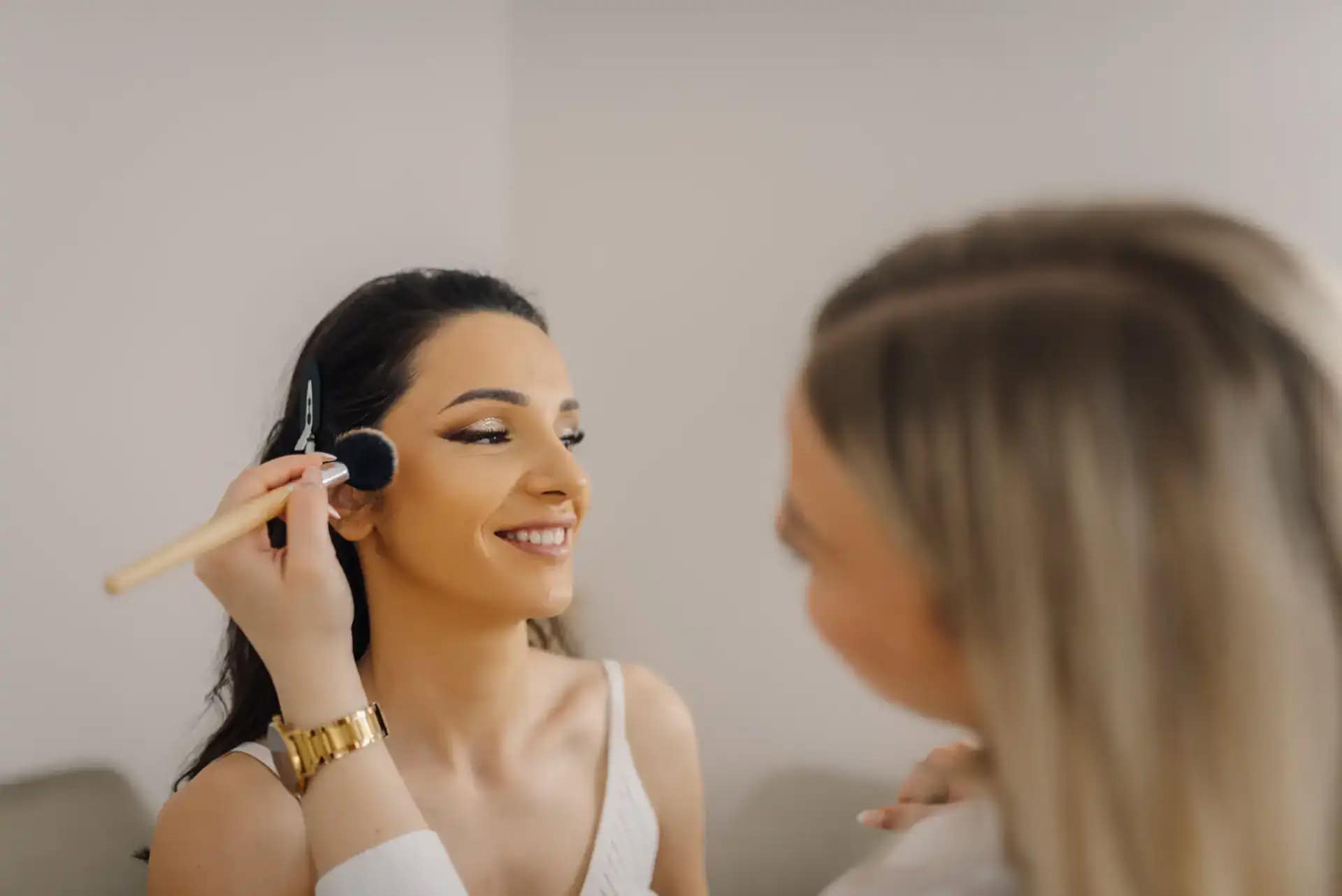 Bridal makeup application at Beauty Bar & Spa with professional artist.