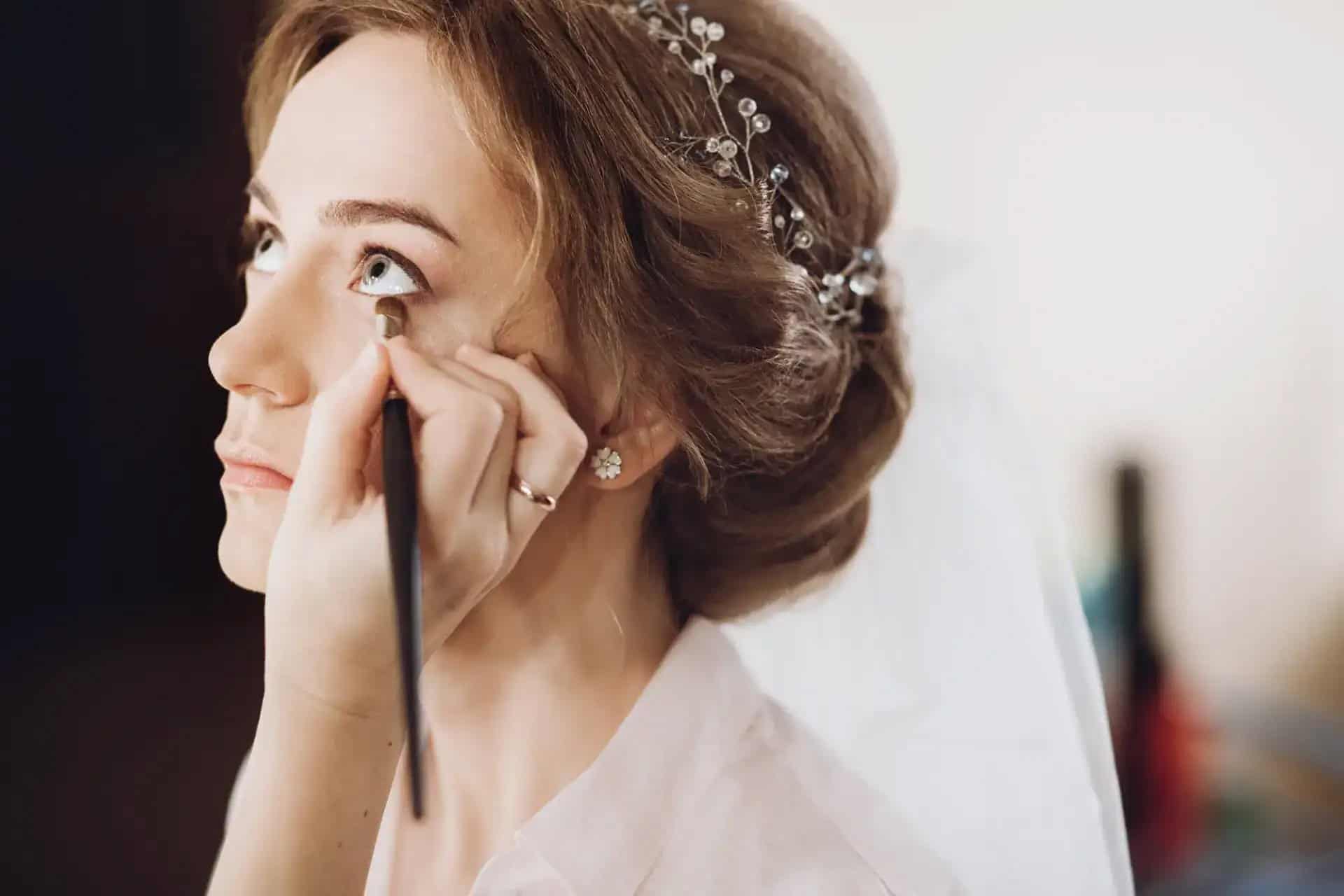 Bride getting makeup done for wedding at Beauty Bar & Spa.