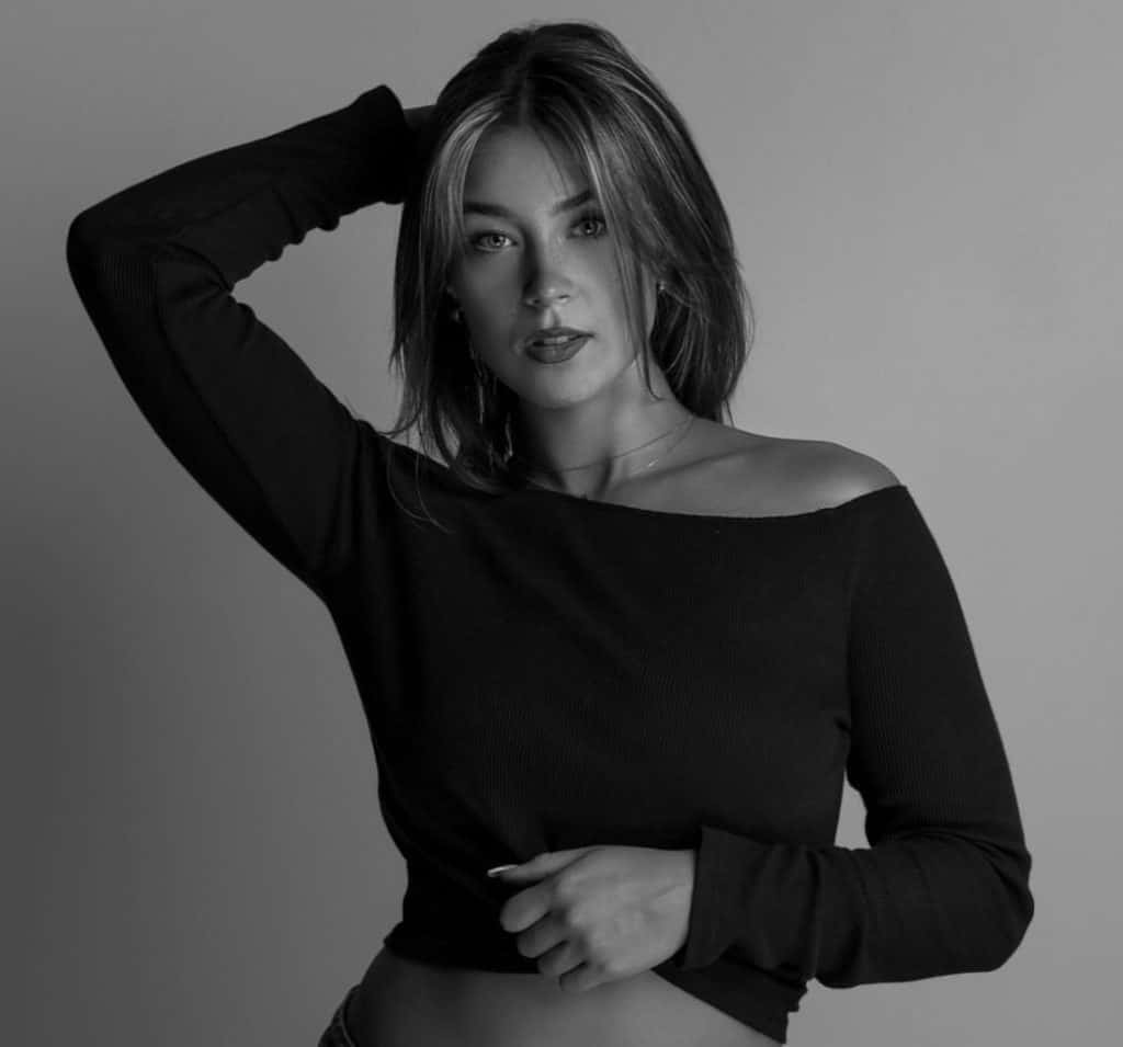 Elegant woman with styled hair in black and white for Beauty Bar & Spa.