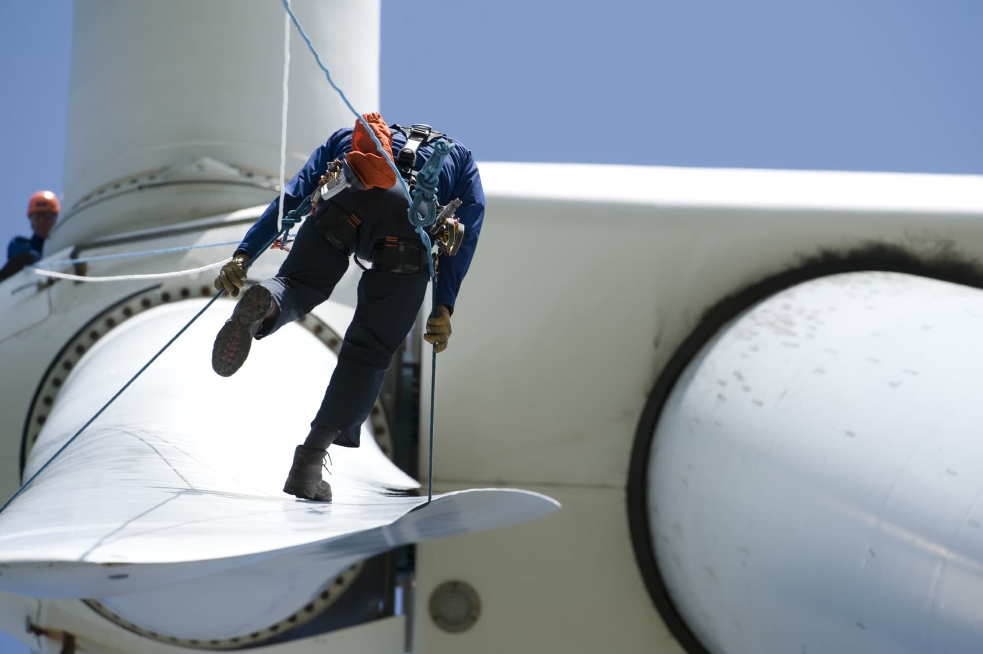 Two rope access technicians inspect a wind turbine at the Fenner wind farm in New York State.