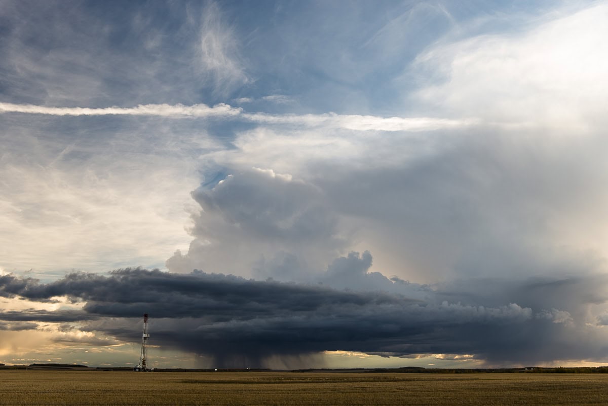 Oil rig and thunder cloud near Dawson Creek.