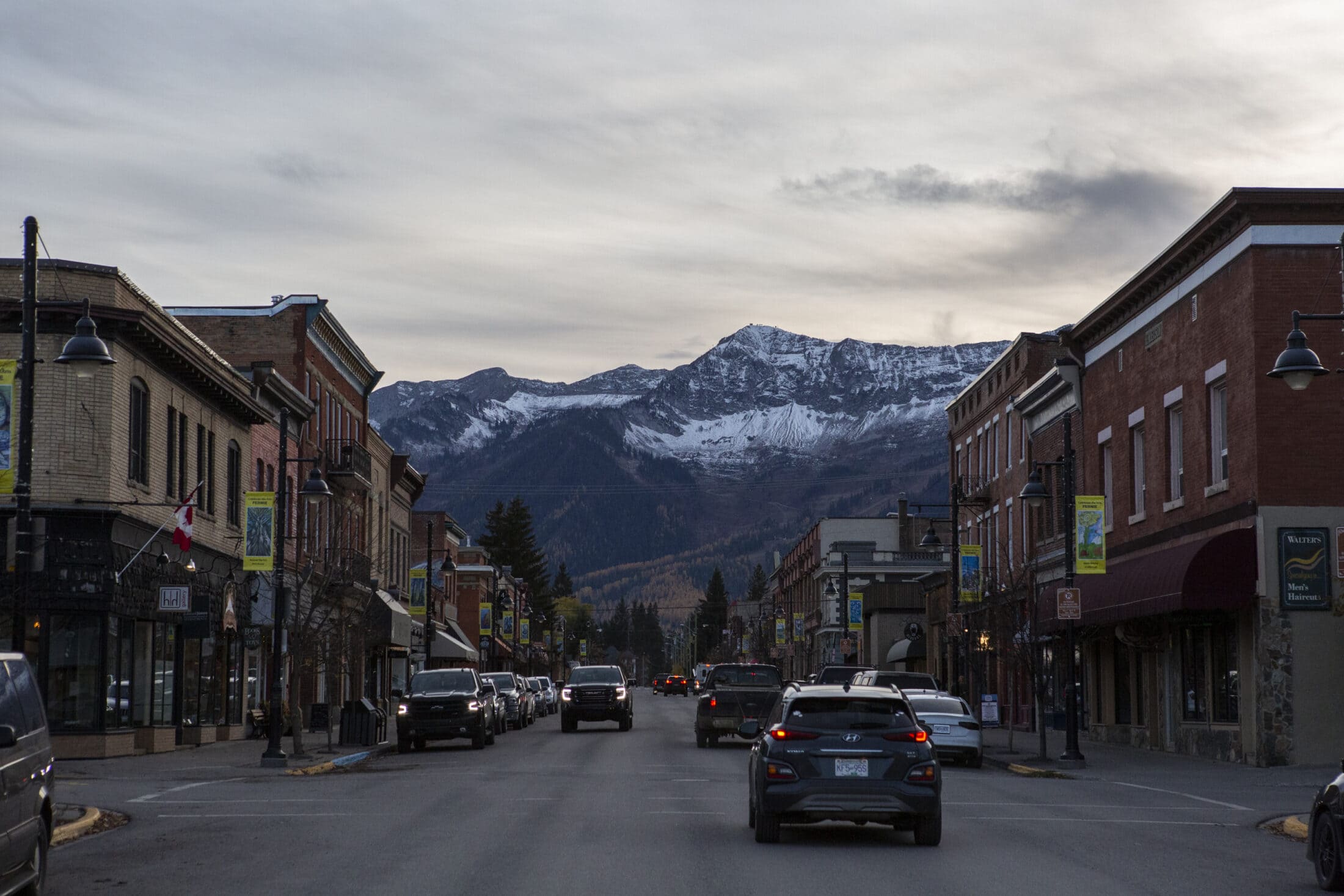 A street scene with snow-capped mountains in Fernie, B.C.