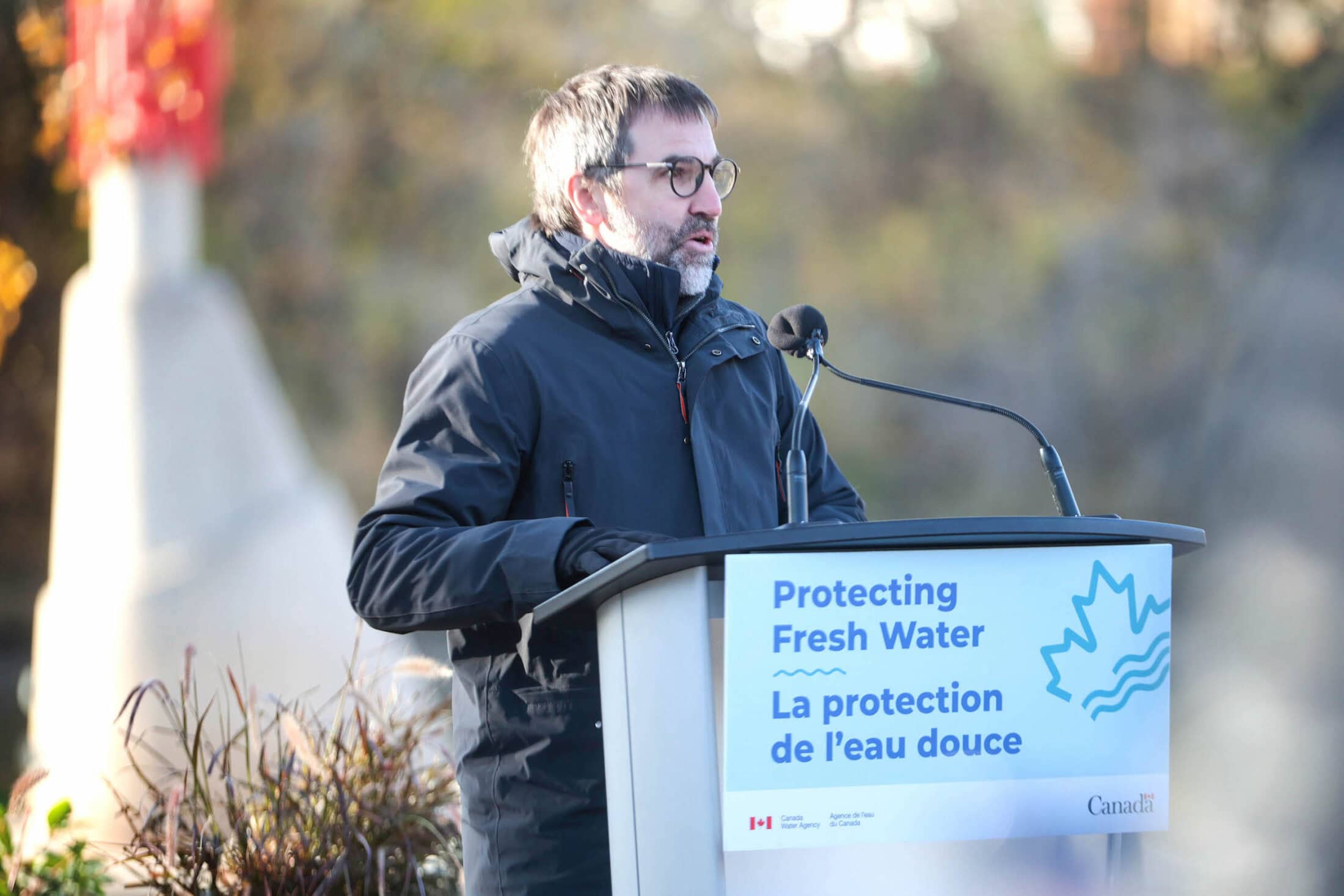 Environment Minister Steven Guilbeault announces the launch of the Canada Water Agency at an outdoor podium