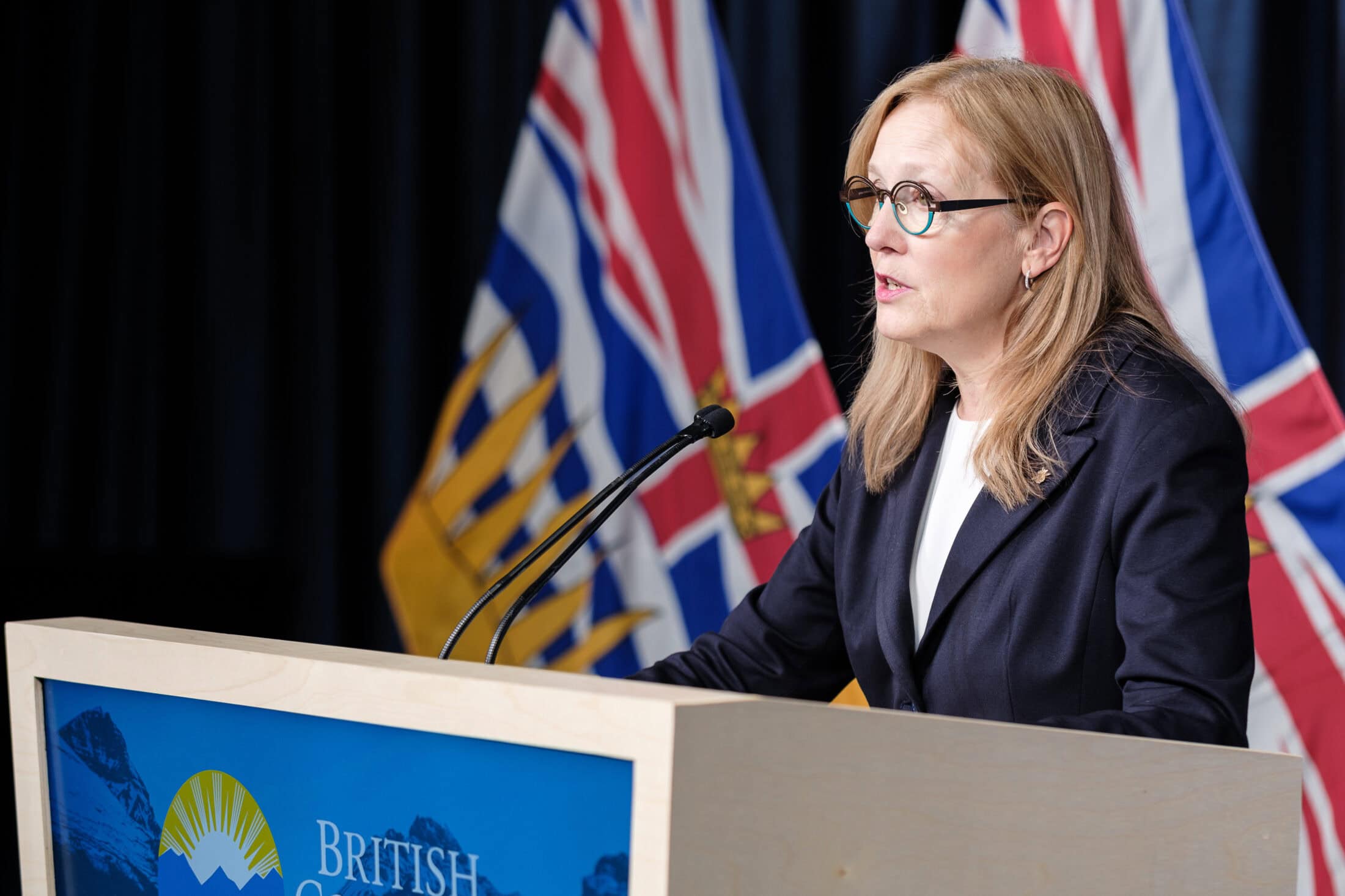 Finance Minister Brenda Bailey at a podium