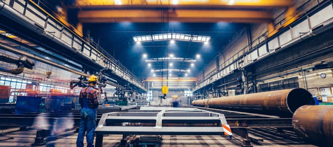 man standing in factory