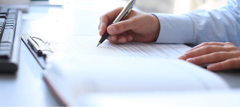 program and development img of man writing notes