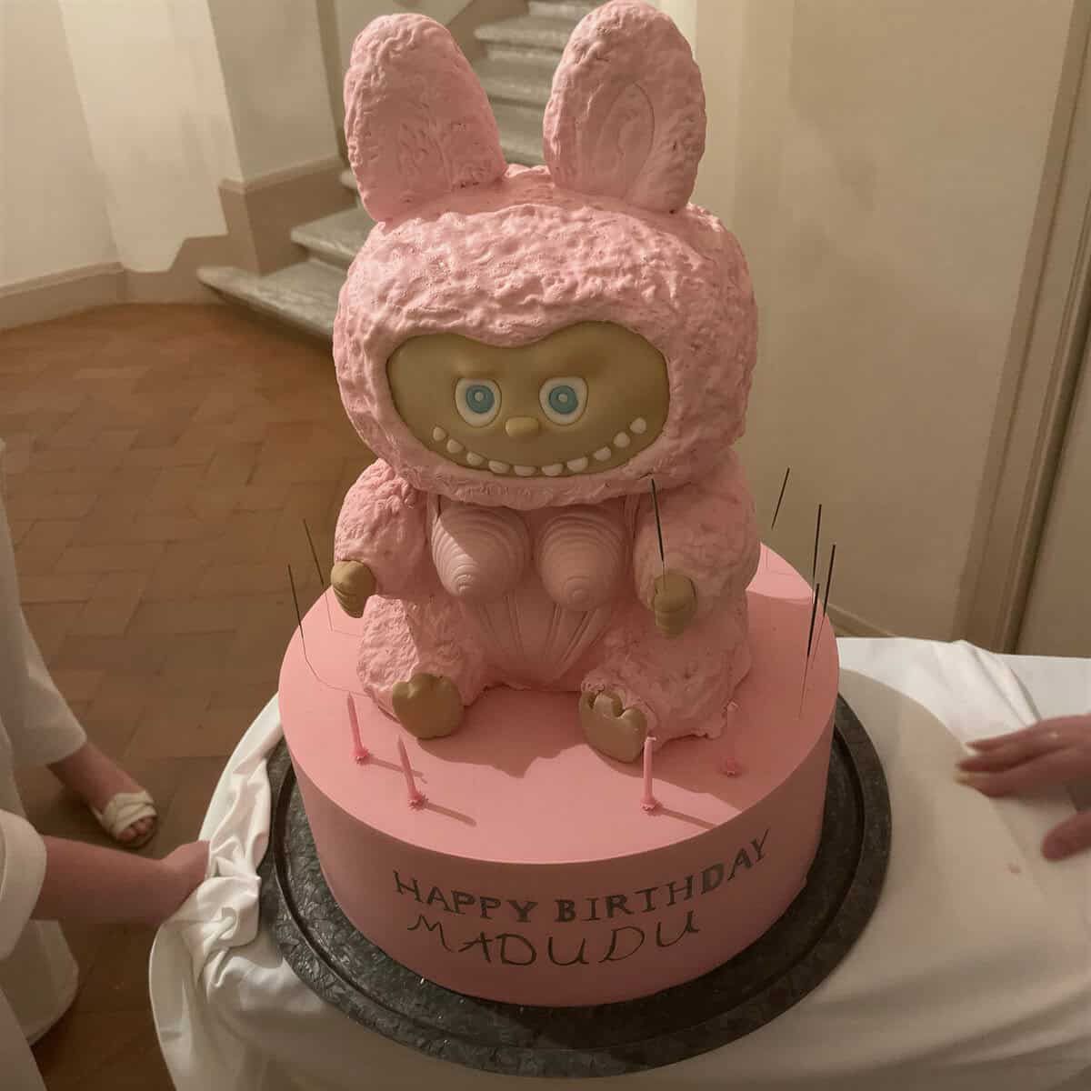 Finished Labubu birthday cake being carefully wheeled into a hotel in Siena for Madonna’s 67th birthday.