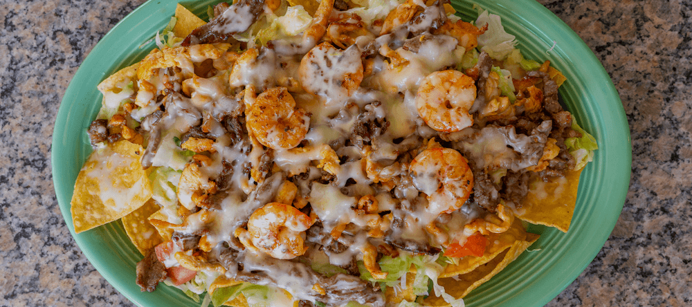 Delicious seafood nachos with shrimp, cheese, and toppings at Puerto Vallarta restaurant.