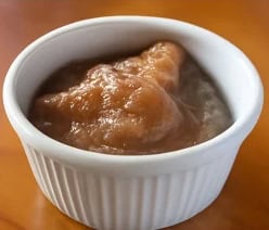 Creamy coleslaw served in a white ramekin, fresh and appetizing.
