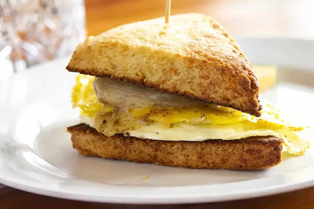Sausage, egg, and cheese breakfast sandwich on toasted bread.
