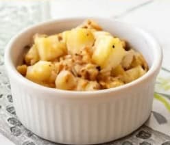 Creamy coleslaw with pineapple chunks and shredded vegetables.