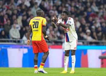 Malang SARR of Lens and Moussa NIAKHATÉ of Olympique Lyonnais during French Cup match between Lyon and Lens at Groupama Stadium on March 5, 2026 in Lyon, France. (Photo by Daniel Derajinski/Icon Sport via Getty Images)
