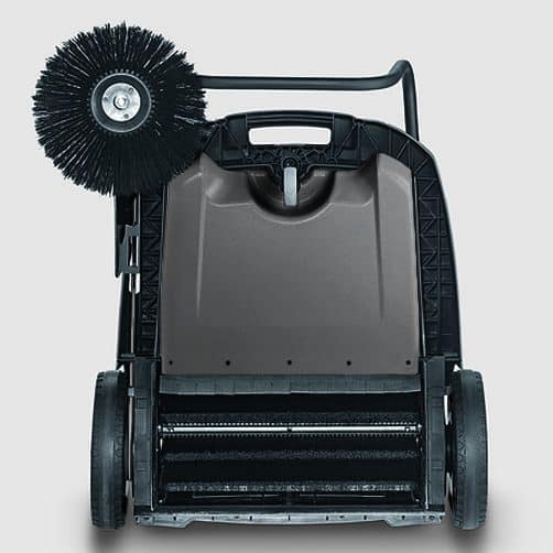 Power cleaning equipment with brush attachment for commercial cleaning.
