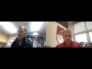 Two men in a video call discussing wrestling topics for Weekly Round Up.