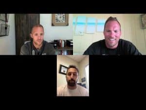 Wrestling coaches discussing techniques in a virtual meeting.