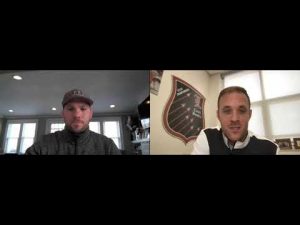 Two coaches in a video call discussing composure in wrestling.