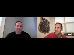 Two men in a video call discussing coaching schedules for wrestling.