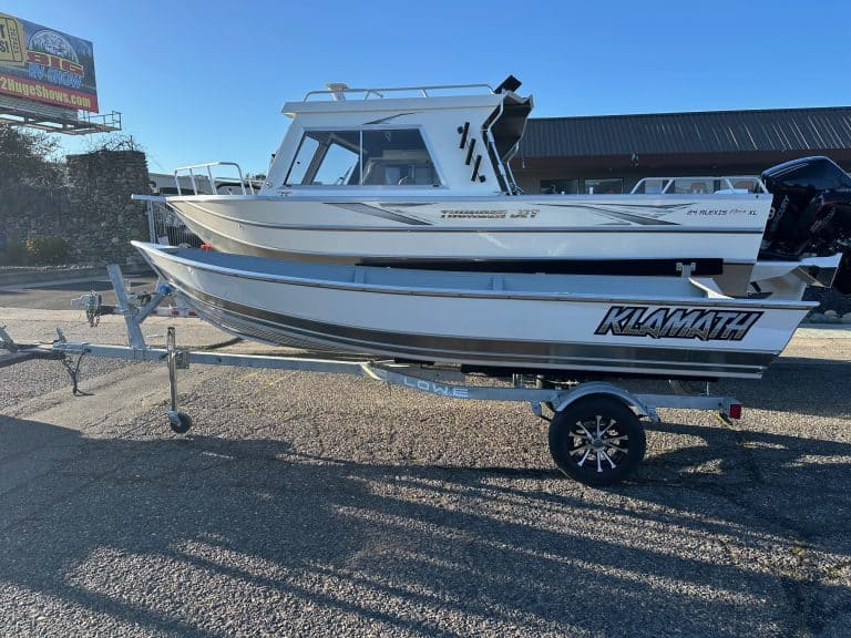Klamath 15 Advantage S fishing boat on trailer at dealership.