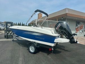 New Element Marine boat with Mercury outboard motor on trailer, ideal for water sports and fishing.