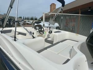 Opti Marine boat interior renovation with modern seating and steering console.