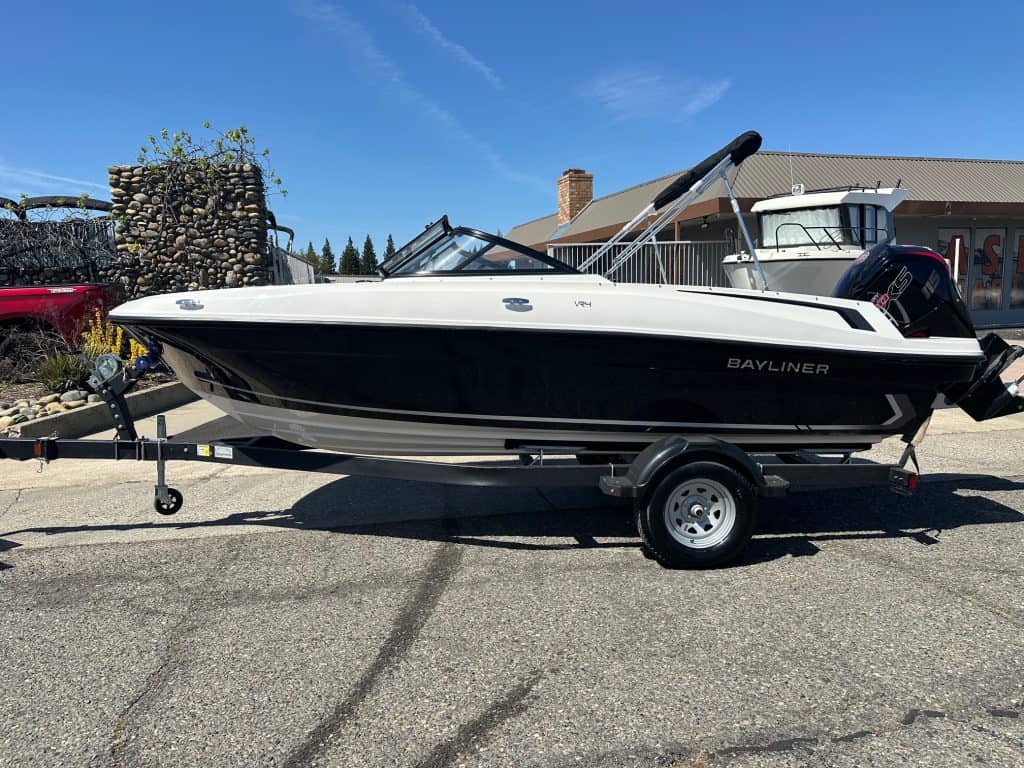 Modern Bayliner VR4 boat with Mercury 115HP engine on trailer.