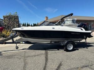 Boat with Mercury 115HP engine for recreational water activities.