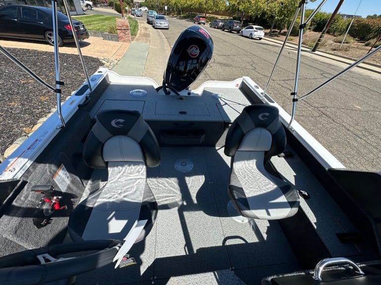Boat interior with two seats and Mercury 115HP outboard motor.