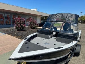 Crestliner Fish Hawk boat with Mercury 115HP outboard on trailer.