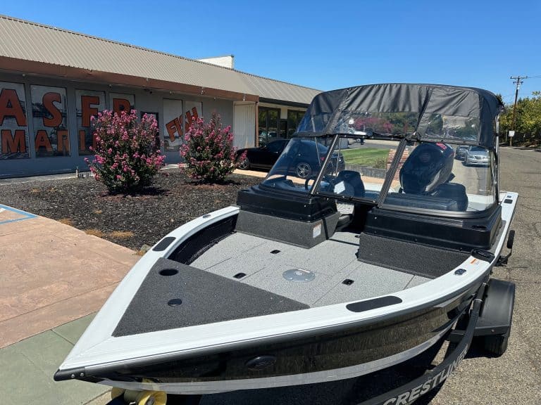 Crestliner Fish Hawk boat with Mercury 115HP outboard on trailer.