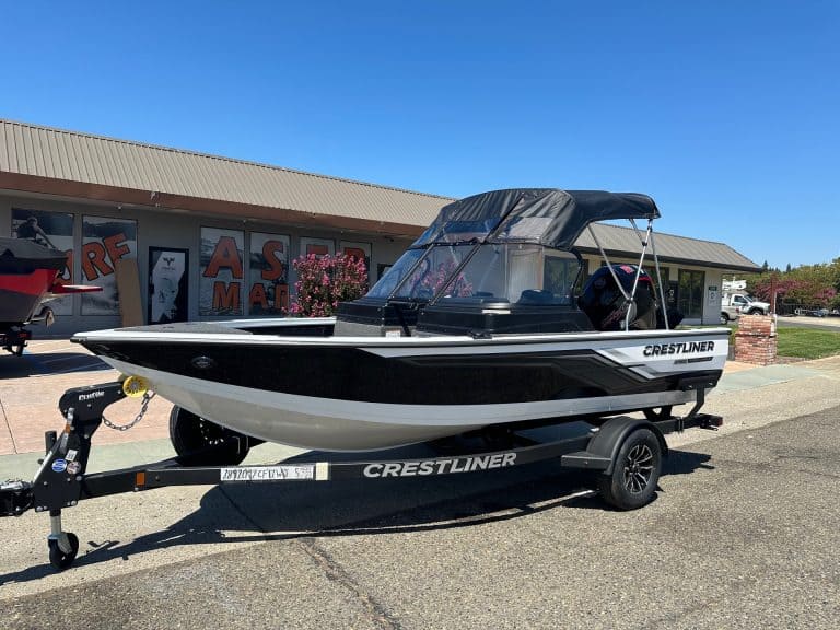 Crestliner Fish Hawk boat with Mercury 115HP outboard on trailer.