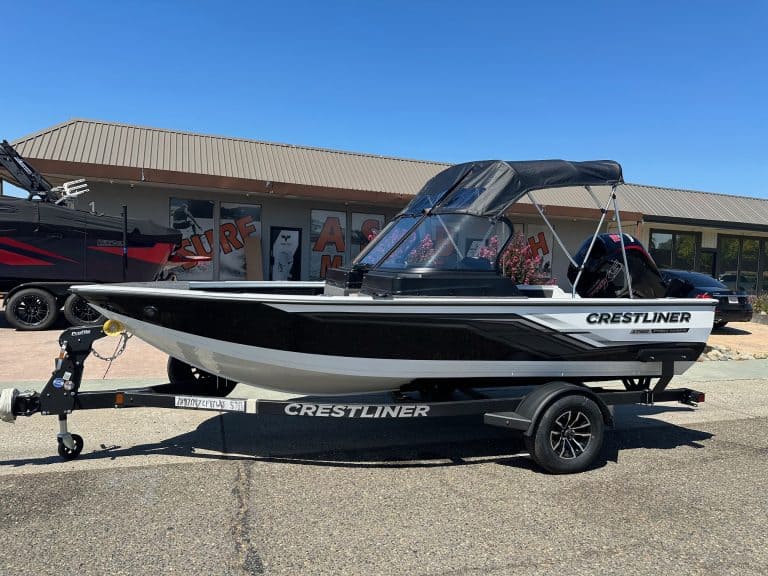 Crestliner Fish Hawk boat with Mercury 115HP outboard on trailer.