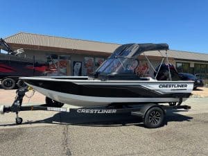 Crestliner Fish Hawk boat with Mercury 115HP outboard motor on trailer, ready for fishing trips.