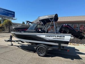 Crestliner Fish Hawk boat with Mercury 115HP outboard on a trailer, ready for fishing adventures.