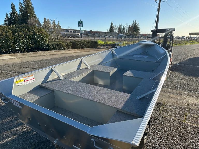 Klamath 15 Advantage S fishing boat on trailer at outdoor lot.