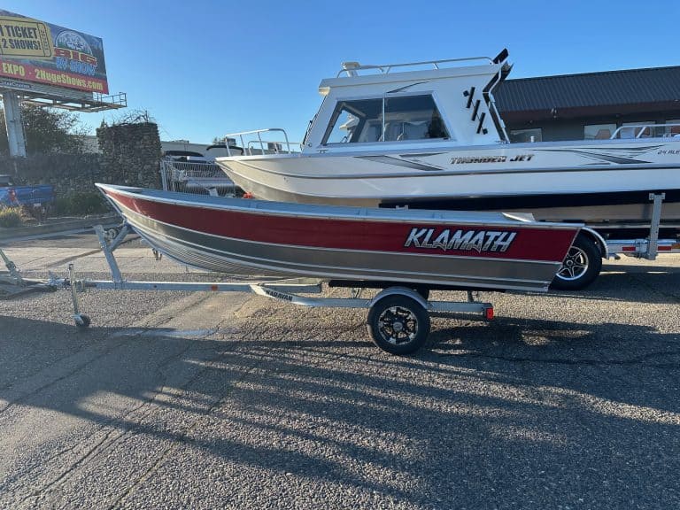 Klamath 15 Advantage S boat on trailer at dealership.