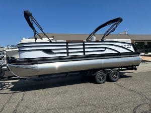 Lowe SS 230 pontoon boat with Mercury 150HP Pro Xs engine on trailer.