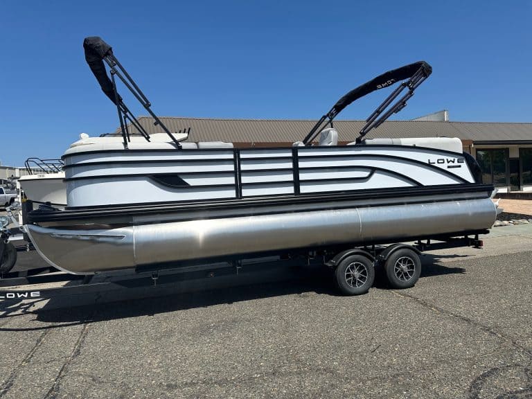 Lowe 2025 SS pontoon boat with Mercury 150HP Pro Xs engine on trailer.