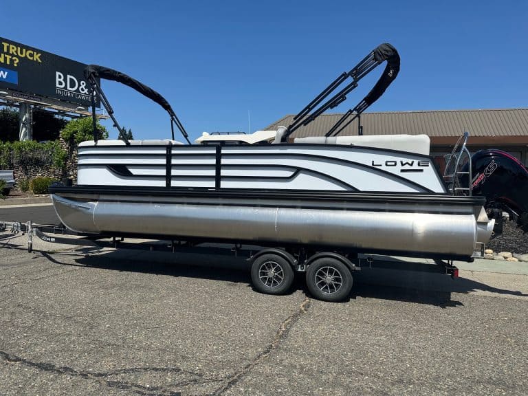 Lowe SS 230 pontoon boat with Mercury 150HP Pro Xs engine on trailer.