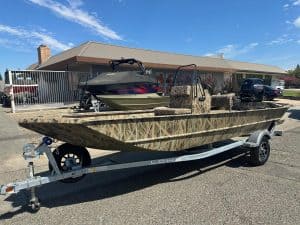 Aluminum Lowe 1860 RX fishing boat with Mercury 80HP jet engine, ideal for freshwater and coastal fi.