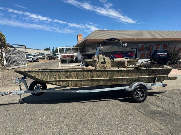 Boat with Mercury 80HP jet engine on trailer for sale.