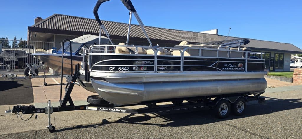 Sun Tracker Fishin' Barge 20 DLX on trailer for sale.