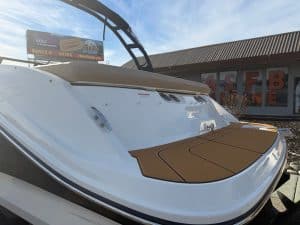 Modern 2026 Bayliner VI20 boat with sleek design and brown seating area.