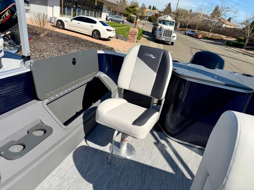 Modern boat helm station with comfortable seating and control panel for optimal navigation.