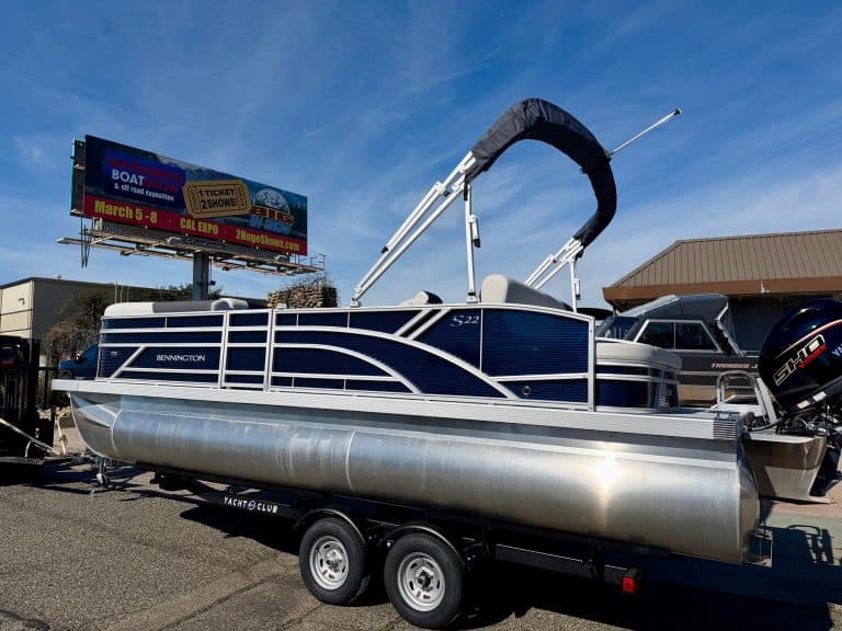 Bennington 22SSB pontoon boat with sleek design and powerful outboard engine. Perfect for family out.
