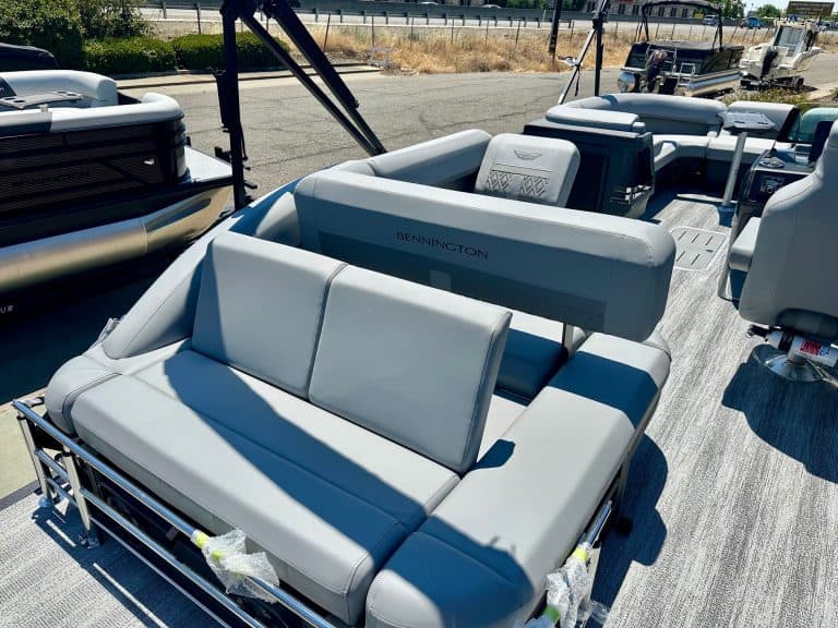 Luxury pontoon boat with comfortable seating and modern design.