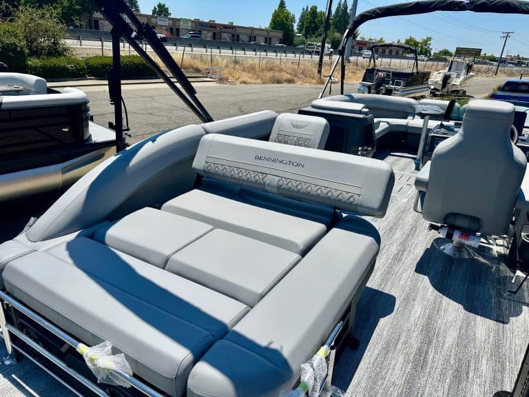 Luxury pontoon boat with modern seating for leisure and water activities.