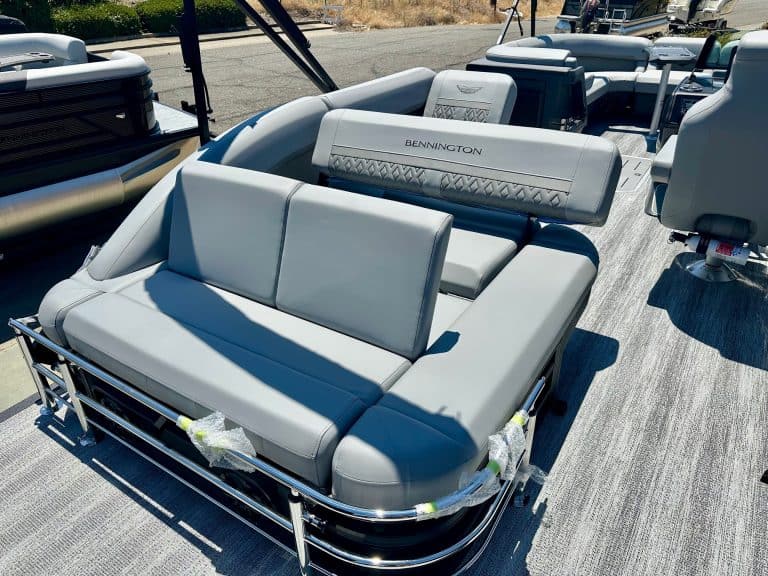 Luxury pontoon boat with comfortable seating and modern design.