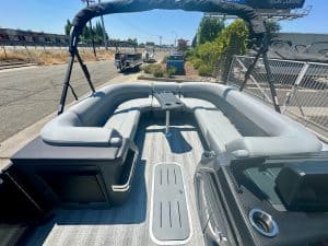 Inflatable boat with comfortable seating, canopy, and durable design for recreational water activiti.